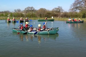 Children in a canoe at Robinwood